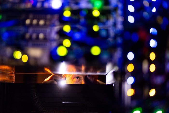 Chris Howard, HPSC account manager, inspects a server rack at the High Performance Scientific Computing’s ISAAC (Infrastructure for Scientific Applications and Advanced Computing) data center on September 30, 2025. Photo by Steven Bridges/University of Tennessee.